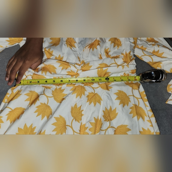 A yellow dress with leaves!!! DRESS IS NOT TRUE TO SIZE MORE LIKE A TEN - Picture 10 of 12